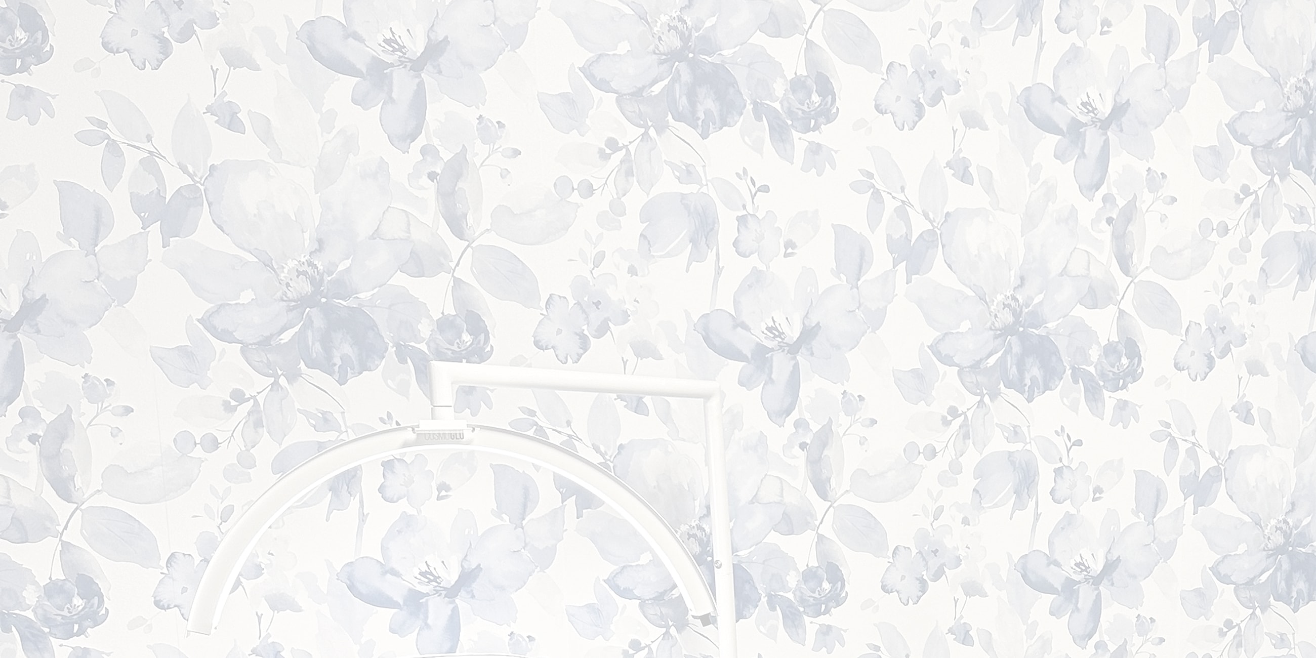 Floral wallpaper with a white light frame.