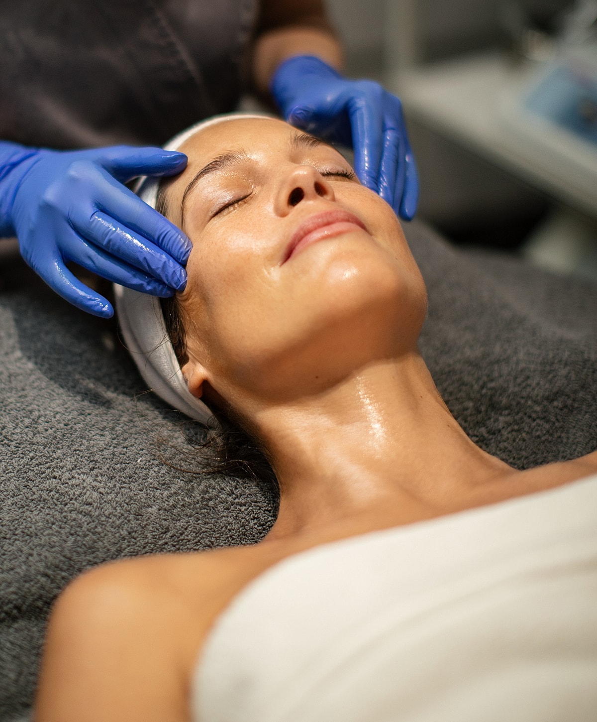 Facial massage treatment in a spa setting.