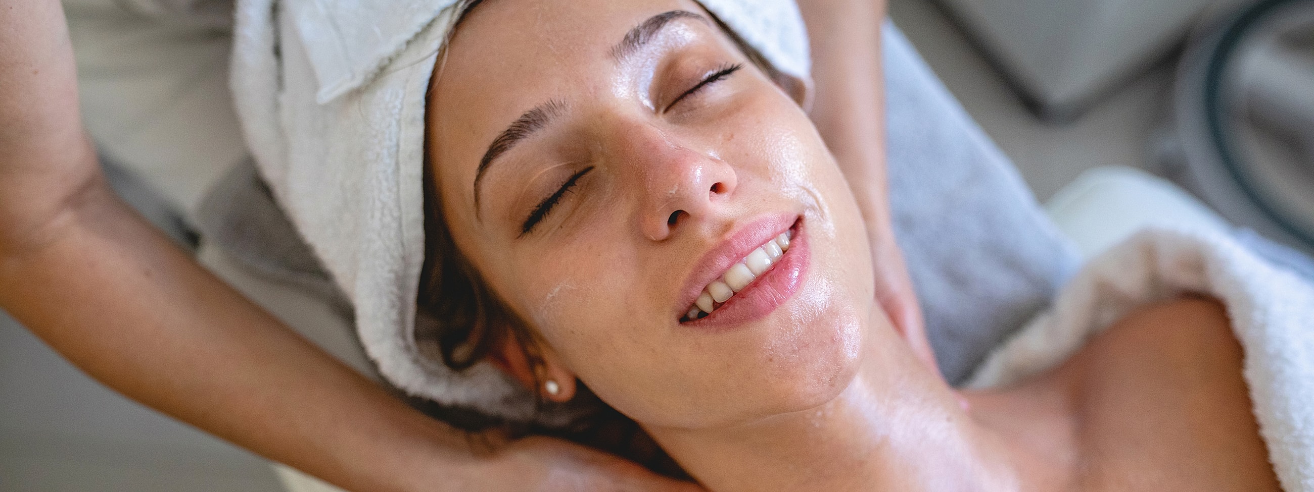 Woman receiving a relaxing facial treatment.