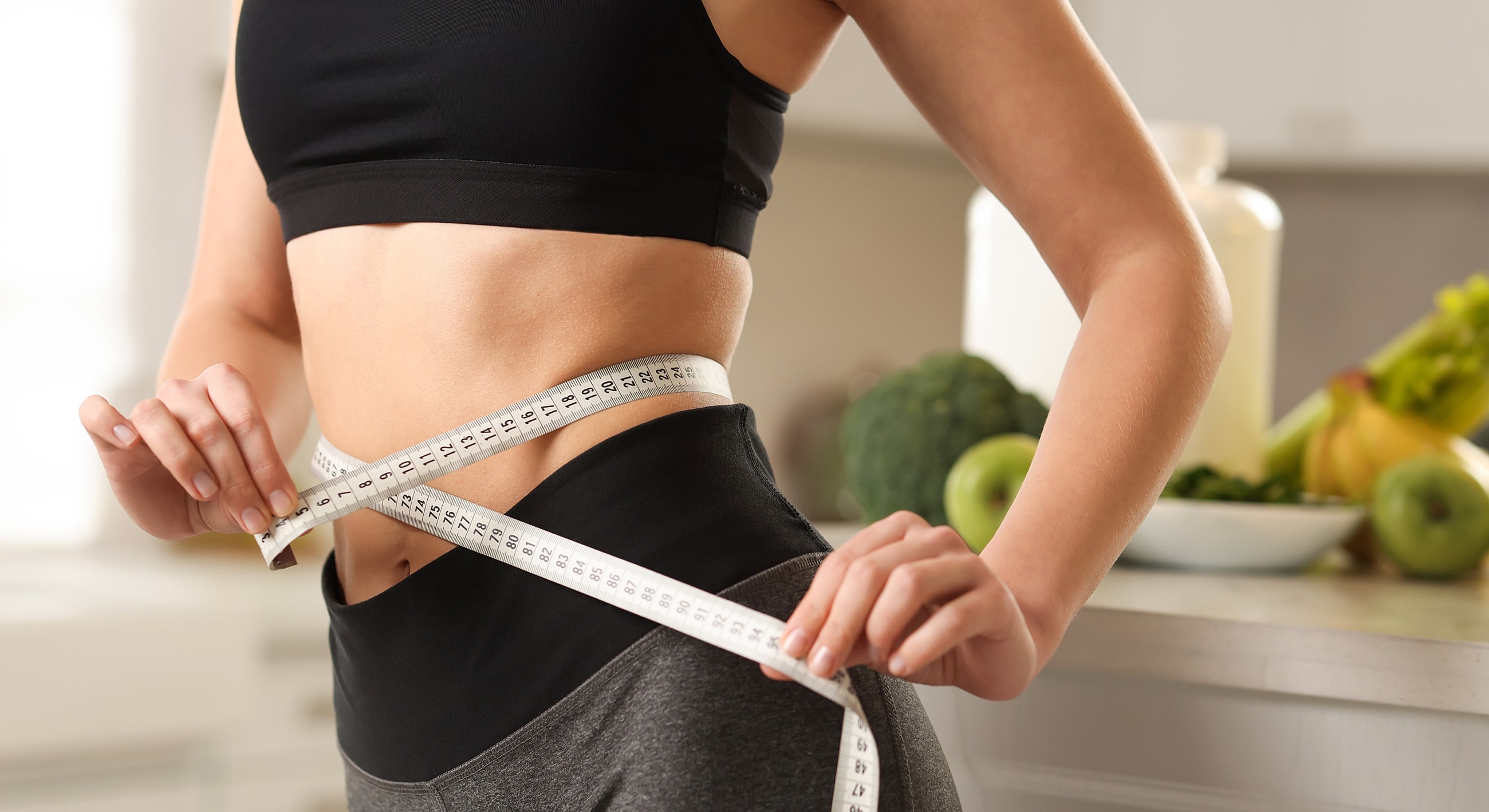 Measuring waist for fitness or health goals.